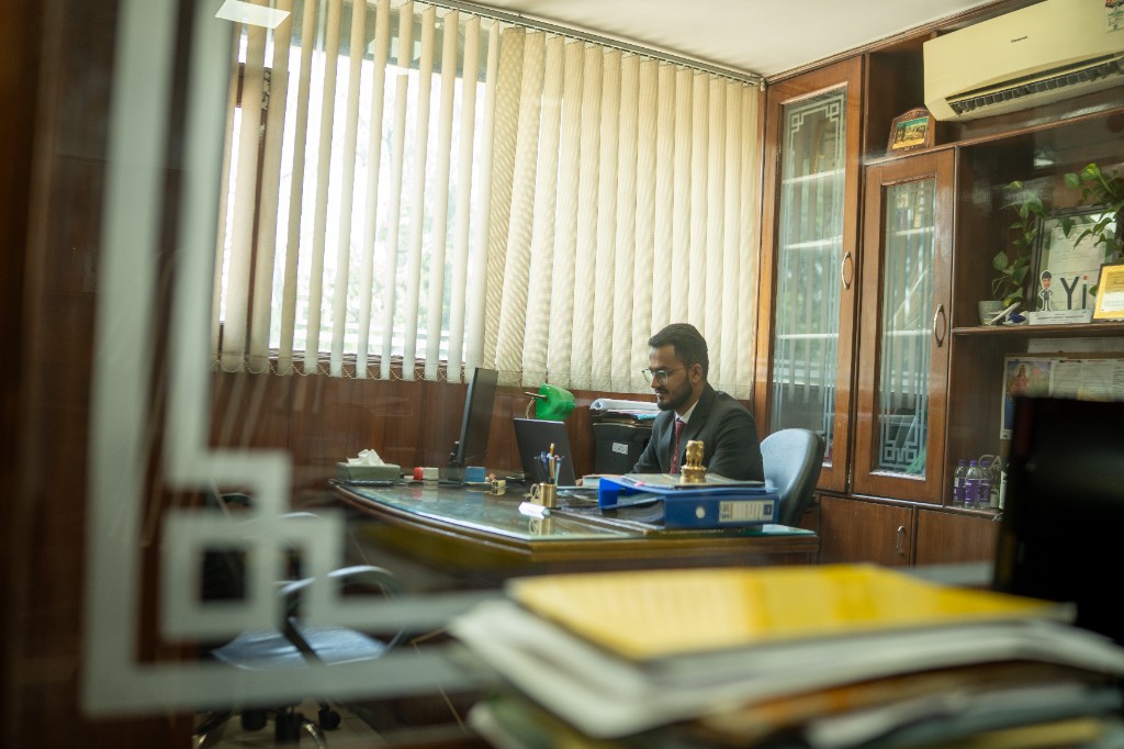 CA Anuj Singh working in his office